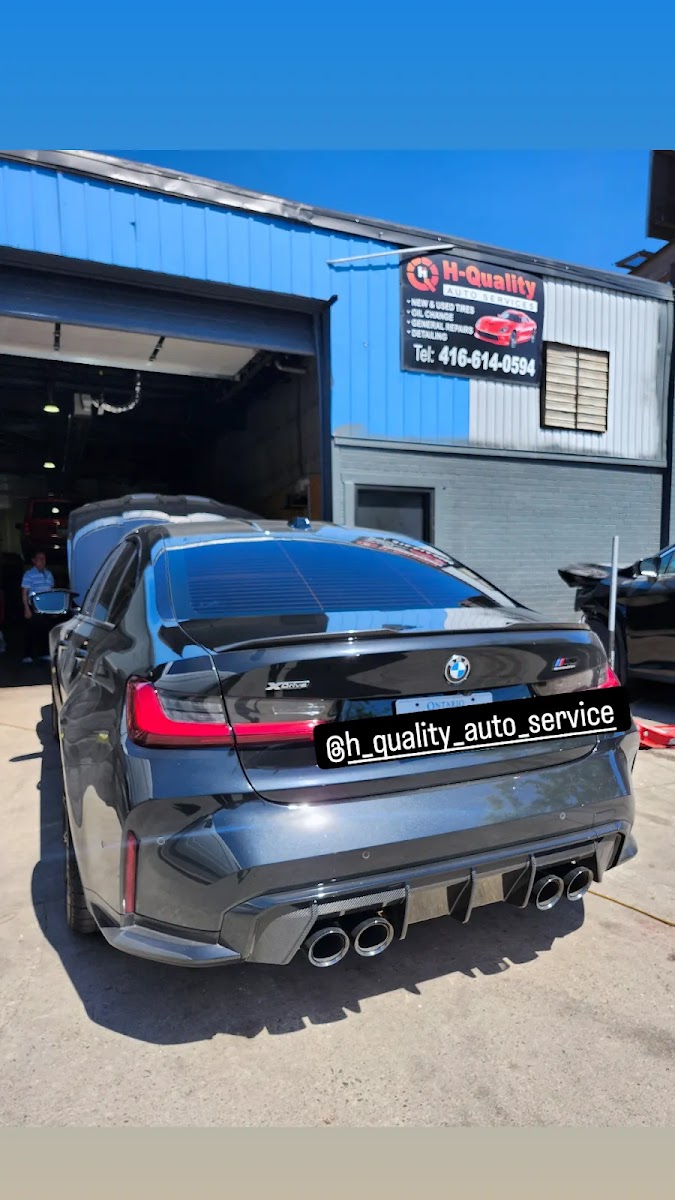 A view inside the High Quality Auto bay during a service.
